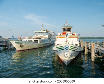 Ships of the Chiemsee Schifffahrt in the harbor of Prien. Lake Chiemsee in the Chiemgau. The foothills of the Bavarian Alps in Upper Bavaria, Germany