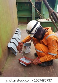 Ship's Crew Is Painting Front Cover Of Ballast Tank Air Vent Heads