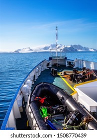 Ship's deck with zodiac boat, heading to Antarctic continent