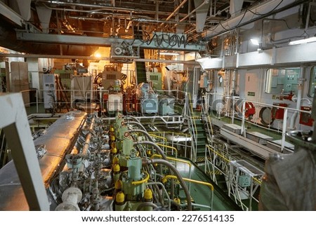 Ship's engine room. Vessel's ( Ship ) Engine Room Space  industrial stairs. Ship's Engine Heavy Machinery Space - Pipes, Valves, Engines