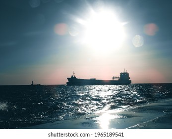 ships on sea during sunset