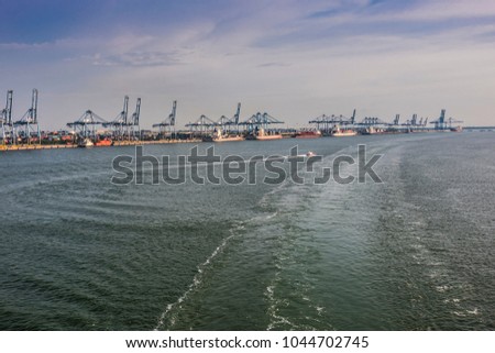 ships unloading containers and cranes in port klang malaysia