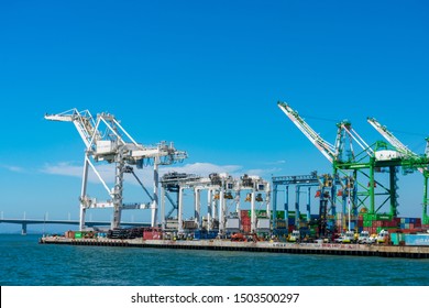 Ship-to-shore gantry cranes at berth of Ben E. Nutter Terminal servicing Evergreen Marine Corporation  and STS shipping containers - Oakland, California, USA - Circa, 2019