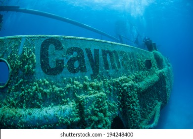 A Shipwreck Has Been Intentionally Sunk As A Diving And Snorkeling Attraction In Grand Cayman Island. Shipwrecks Can Serve As Artificial Reefs, Attracting A Diverse Array Of Marine Life.