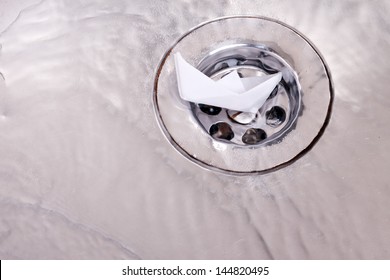 Shipwreck.Toy Paper Boat Sinks In The Sink