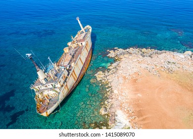 Shipwreck. The ship ran aground the top view. The ship crashed on the coastal cliffs. Abandoned marine vessels. The ship lies on the tank view from the drone. - Powered by Shutterstock