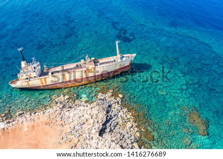 Shipwreck view from drone. The merchant ship sank. Marine catastrophe. The ship ran aground the top view.  Abandoned marine vessels. Ocean from above. Mediterranean Sea. Turquoise water.