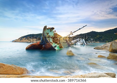 shipwreck or wrecked cargo ship abandoned on sea bay