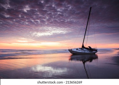 Shipwrecked boat on the Cape Hatteras National Seashore at sunrise in North Carolina Outer Banks.