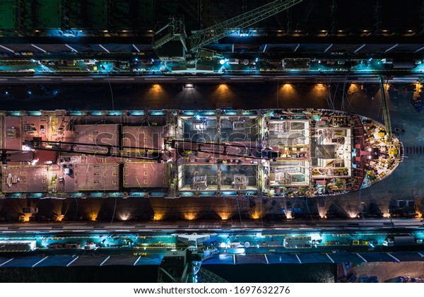 shipyard\
repair on the sea at night aerial top\
view