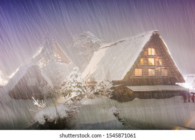 Shirakawago, Japan Historic Winter Village At Night During Snow.