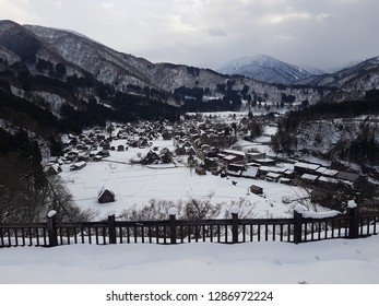 Shirakawago surrounded by mountains covered with snow