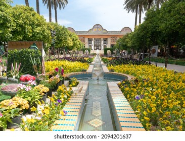 Shiraz, Iran - 04.14.2019: People Walking In Eram Persian Garden Of Shiraz On A Beautiful Sunny Day. Lots Of Colorful Flowers In Beautiful Persian Garden