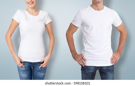 Shirt design and people concept - close up of young man and woman in blank white t-shirt with shadow front and rear isolated on blue background. - Shutterstock ID 598158101