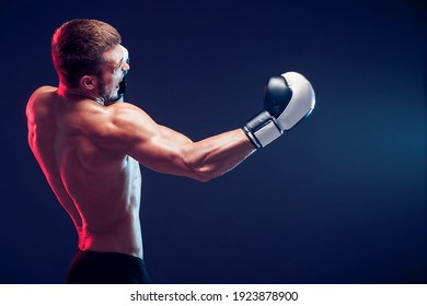 shirtless boxer with gloves on dark background. Isolate - Powered by Shutterstock