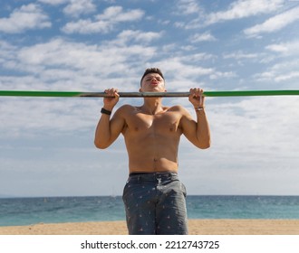 Shirtless Boy Practicing Pole Sport