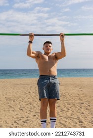 Shirtless Boy Practicing Pole Sport