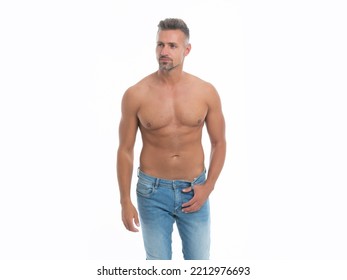 Shirtless Guy With Muscular Torso In Studio. Muscular Torso Of Shirtless Guy Wearing Jeans