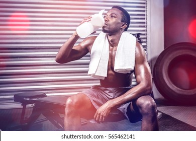 Shirtless Man Drinking Protein Shake At The Crossfit Gym