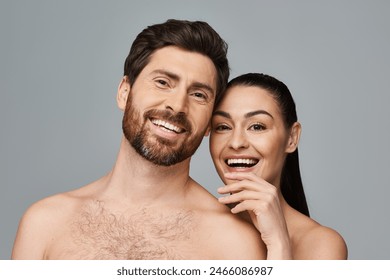 Shirtless man and woman pose. - Powered by Shutterstock