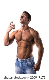 Shirtless Muscular Male Model Spraying Cologne On White Background, Eyes Closed