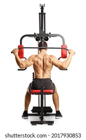 Shirtless musuclar man exercising back muscles with a bar on a fitness machine isolated on white background