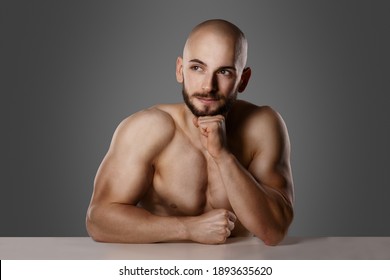 Shirtless Turkish Man Think About Idea Leaning With Elbow On Table And Having His Fist On His Chin  