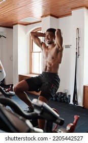 Shirtless Young Black Man Doing Intense Cardio Workout On Exercise Bike At The Gym