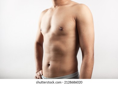 Shirtless Young Healthy Male Showing His Fit Belly And Torso In White Background