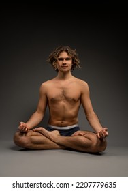 Shirtless Young Male Meditating In Padmasana Pose