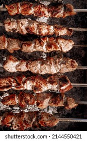 Shish kebabs are cooked on the grill, top view