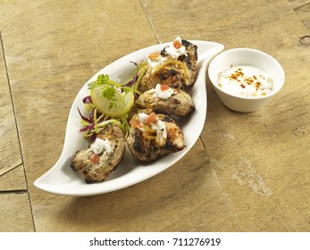 Shish Taouk(Chicken) Served In A White Plate On Wooden Background