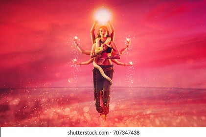 Shiva With Eight Hands Fantasy Concept. Woman Dancing With Snake On Pink Background.