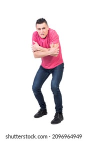 Shivering Man Standing In Studio With Crossed Arms