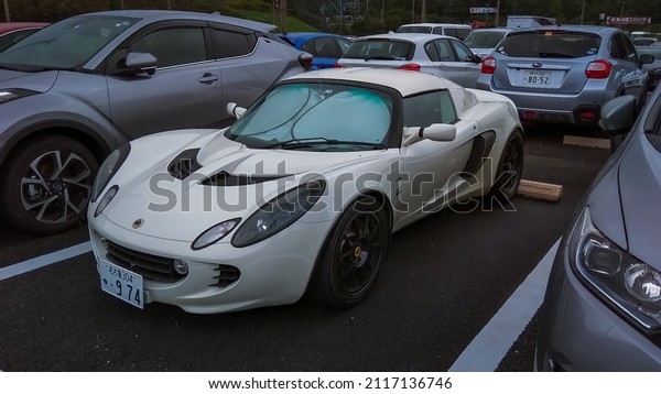 Shizuoka Japan September 8 2018 white Lotus\
Elise on parking lot during rainy\
day