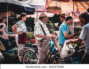 Shkoder, Albania - 07 10 2019: Albanian Elderly People Selling Vegetables And Fruits In A Local Market At City Of Shkoder, Albania.