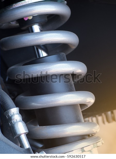 Shock absorber. Close up of a shock\
absorber in motorcycle racing. Selective\
focus.\
