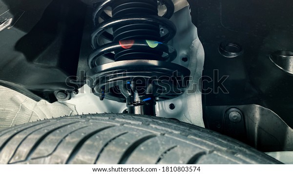 shock absorber strut with coil spring, suspension\
system of modern car