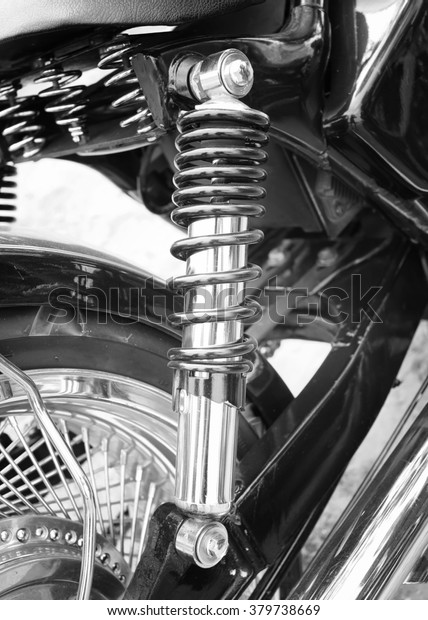 Shock Absorber\'s motorcycle . focus on suspension\
-black and white.