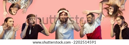 Shock. Group of young surprised and annoyed men and girls face the transparent glass isolated on pink background. Emotions, sales, human rights, social gathering, ad. Models leaning against glass