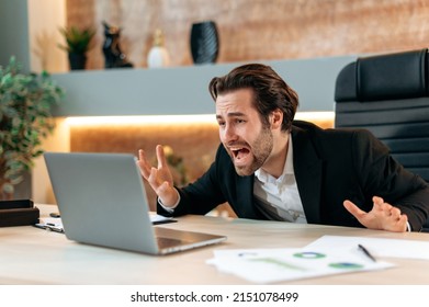 Shocked Annoyed Angry Caucasian Business Man, Stock Trader, Product Manager, Working In A Modern Office, Yelling To The Laptop, Frustrated By The Disruption Of An Important Deal, Financial Losses