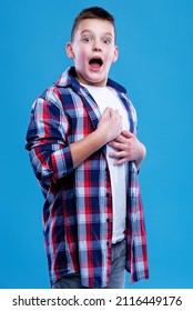 Shocked And Appalled Young Teenage Boy Making A Gasp Expression, Blue Background