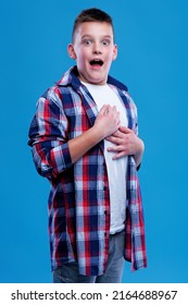 Shocked And Appalled Young Teenage Boy Making A Gasp Expression, Blue Background