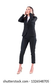 Shocked Business Woman With Head In Hands Looking Up In Despair. Full Body Isolated On White Background. 