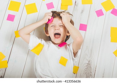 Shocked Child With Empty Stickers On His Body. Stress From Studying, Doing Homework.