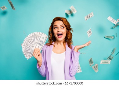 Shocked crazy professional woman hold money fan lottery earnings hold hand impressed dollars falling fluying wear violet formalwear jacket isolated teal turquoise color background - Shutterstock ID 1671703000