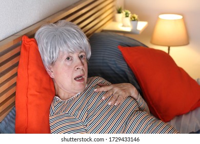 Shocked And Dramatic Senior Woman In Bed