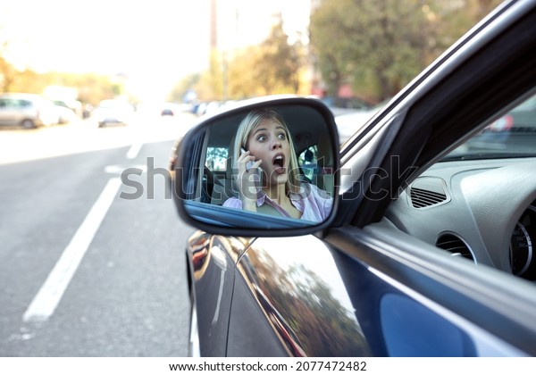 Shocked face in the side view mirror, unsafe\
reckless driving