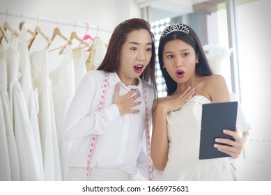 Shocked Faces Of Brides And Wedding Dress Shop Owners They Look At The Tablet