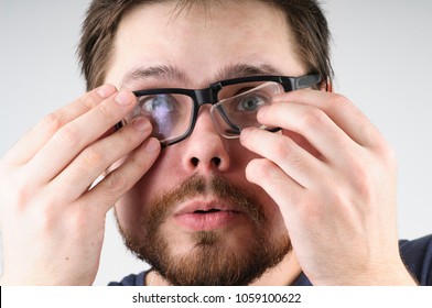 Shocked Man With Broken Glasses On His Face